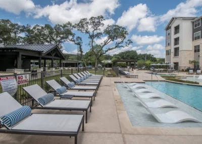 seating around a pool and in a pool